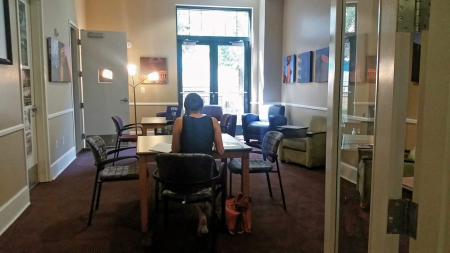 A student studies in the new transfer center space in the GrandMarc.