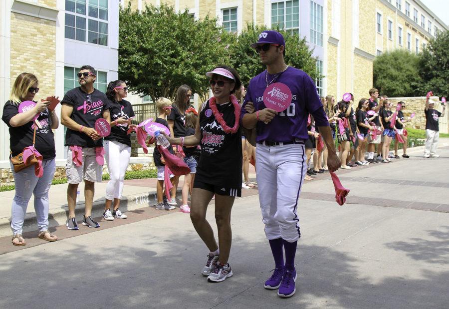 TCU baseball team escorts breast cancer survivors during the filming of Frogs for the Cure video, Sunday, Aug. 30. (Alexandra Plancarte/TCU360)