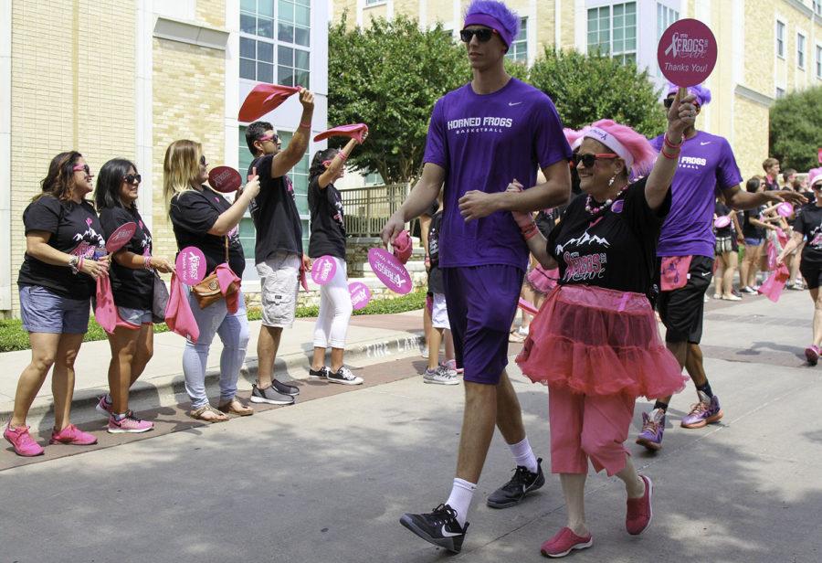 TCU mens basketball team escorts breast cancer survivors during the filming of Frogs for the Cure video, Sunday, Aug. 30. (Alexandra Plancarte/TCU360)