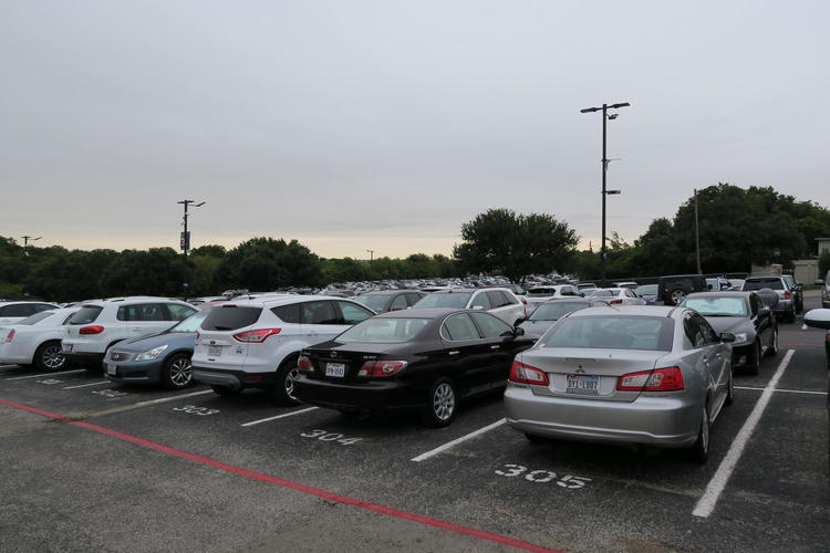 Occupied parking spots in Lots 3 and 4 stretch into the distance. Many of these cars will be able to fit in the new parking garage upon its completion.