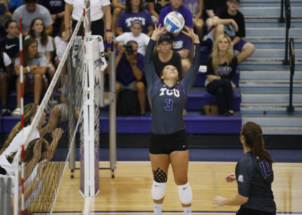 Alexia Heist sets the ball against Texas State during the Crosstown Classic in Fort Worth on Aug. 28.