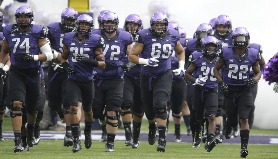TCU+players+take+the+field++before+an+NCAA+college+football+game%2C+Saturday%2C+Sept.+13%2C+2014%2C+in+Fort+Worth%2C+Texas.+%28AP+Photo%2FLM+Otero%29