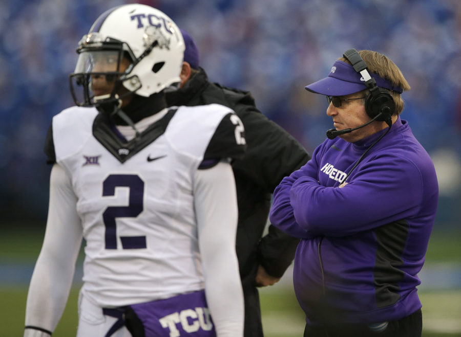 TCU head coach Gary Patterson, right, and quarterback Trevone Boykin (2) stand on the side line during a play review in the first half of an NCAA college football game in Lawrence, Kan., Saturday, Nov. 15, 2014. (AP Photo/Orlin Wagner)