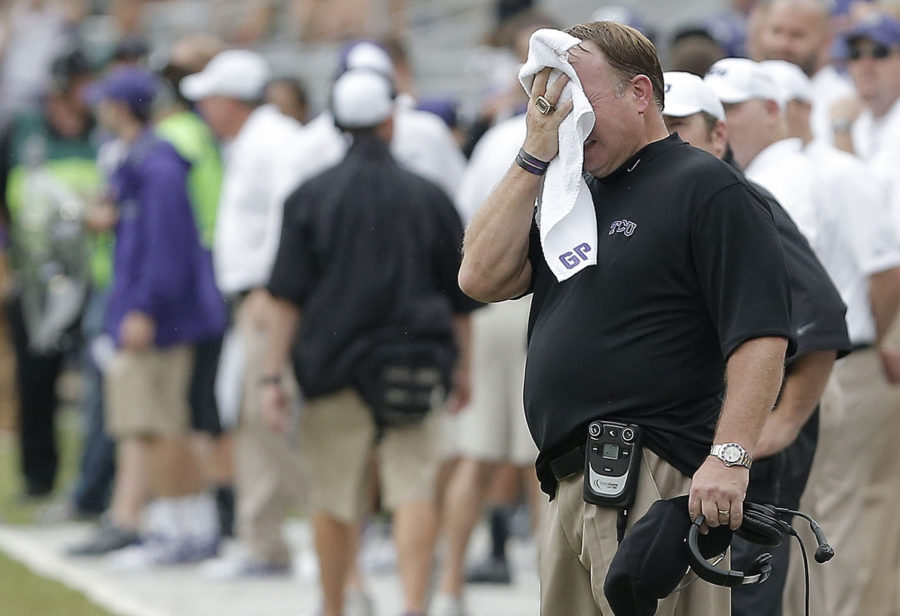 TCU head coach Gary Patterson, black shirt, looks on during the second half of an NCAA college football game against SMU Saturday, Sept. 28, 2013, in Fort Worth, Texas. TCU won 48-17. (AP Photo/Brandon Wade)