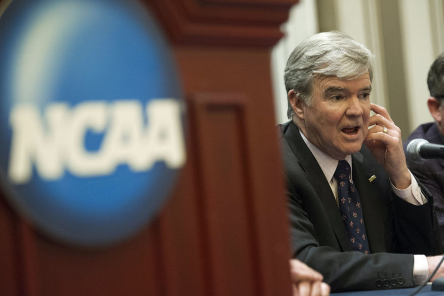 NCAA President Mark Emmert speaks with reporters during a news conference at the NCAA Convention in Oxon Hill, Md., Friday, Jan. 16, 2015.  (AP Photo/Cliff Owen)