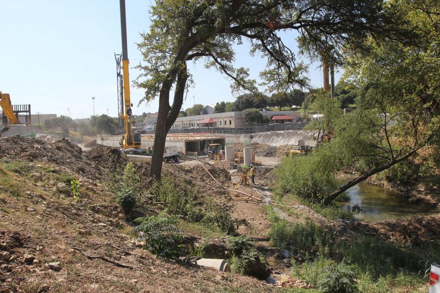 The parking garage will go over the creek. The Worth Hills parking garage is expected to finish by summer 2016. Thursday, Sept. 24, 2015.