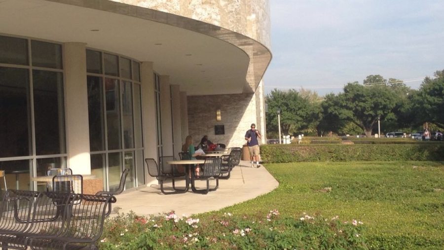 Students hang out and study outside Smith Hall before class. 