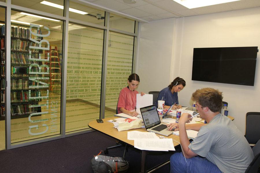From left to right, Ryker Buttry, Kathryn McDonald, Travis Helms. Buttry said she would like to check out new group study room on the first floor of the library. Tuesday, Sept. 29, 2015.