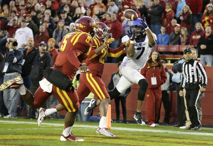 TCU wide receiver Kolby Listenbee (7) catches a touchdown pass in front of Iowa State defenders Kamari Cotton-Moya (5) and Kenneth Lynn, center, during the first half of an NCAA college football game, Saturday, Oct. 17, 2015, in Ames, Iowa. (AP Photo/Charlie Neibergall)