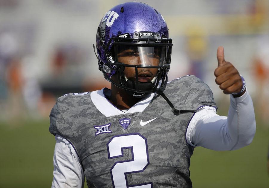 TCU quarterback Trevone Boykin gestures to a teammate before TCU takes on the Texas in a NCAA football game Saturday, Oct. 3, 2015, in Fort Worth, Texas. (AP Photo/Ron Jenkins)