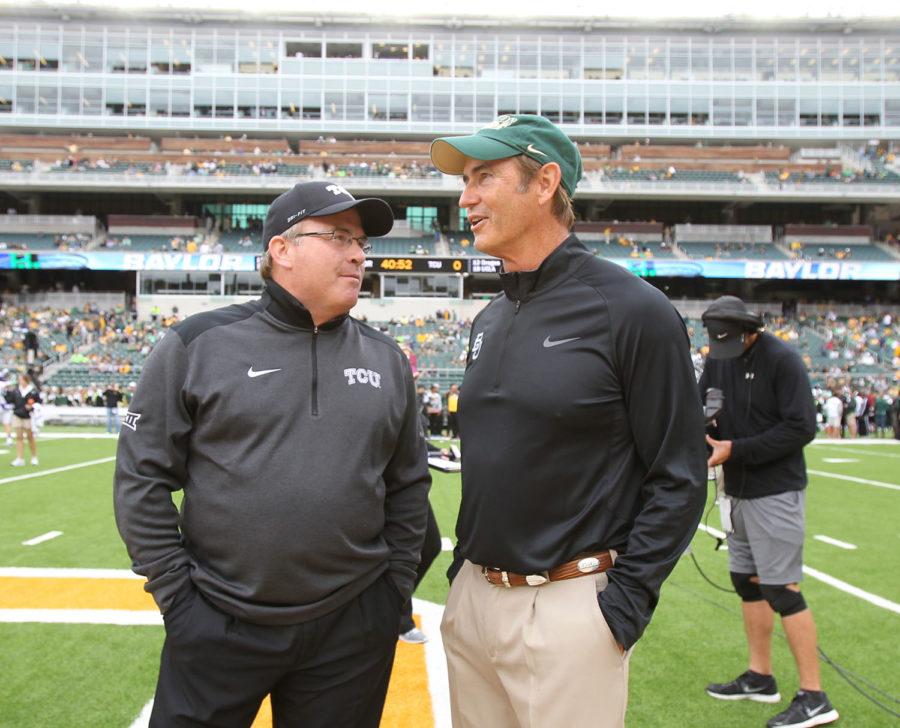 Baylor coach Art Briles, right and TCU Gary Patterson talks before their NCAA college football game, Saturday, Oct. 11, 2014, in Waco, Texas. (AP Photo/Jerry Larson)
