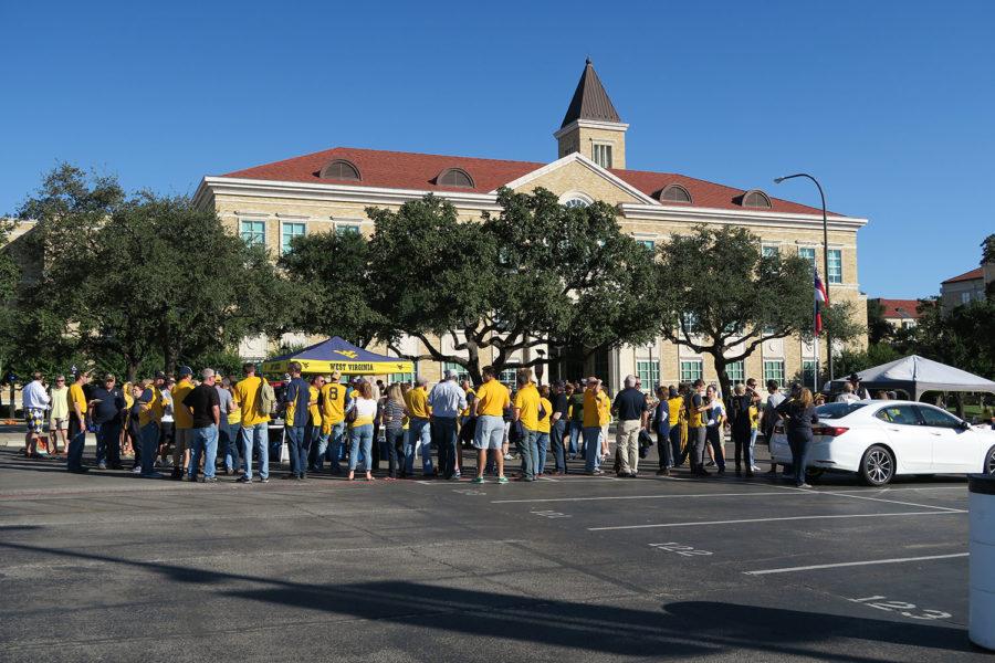 West Virginia Mountaineers tailgaters gathered in the parking lot at Amon G. Carter Stadium around 4:19p.m. when the kickoff began at 6:30p.m.  