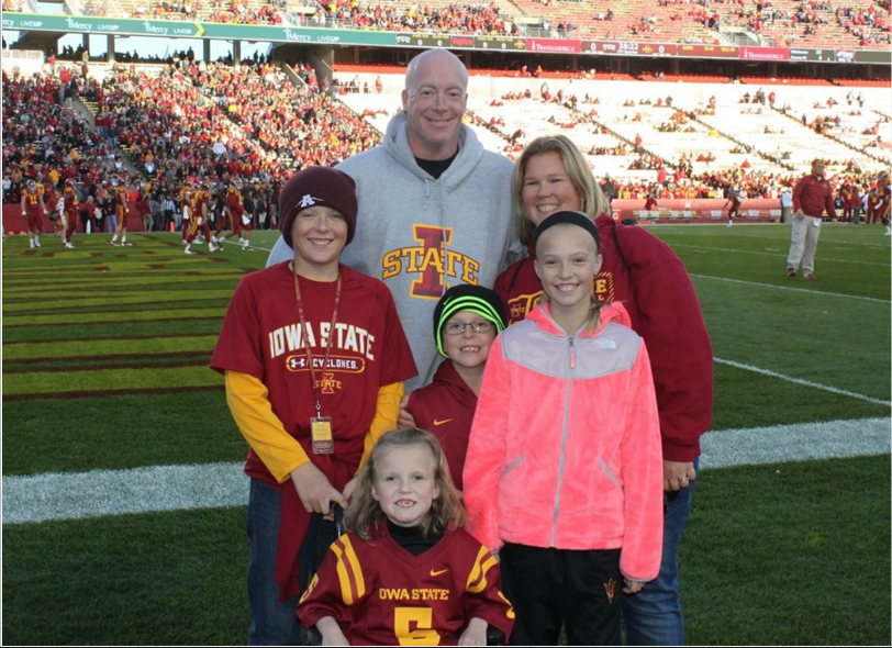 Abby Faber (bottom) and her family pose for a photo at the TCU-Iowa State game on Saturday, October 17. (Courtesy of Abby Fabers youcaring.com donation site)