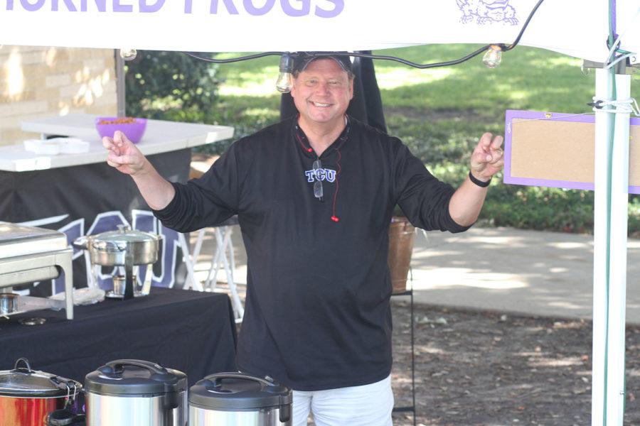 Ken Nicholson, class of 1984, from Aledo, Texas, stands with his tailgate buffet. Hes been tailgating TCU games for the past 16 years.