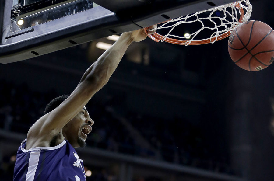TCUs Karviar Shepherd dunks the ball during the first half of an NCAA college basketball game against Kansas in the quarterfinals of the Big 12 Conference tournament Thursday, March 12, 2015, in Kansas City, Mo. (AP Photo/Charlie Riedel)