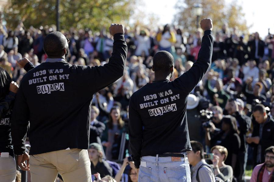 Members+of+the+black+student+protest+group%2C+Concerned+Student+1950%2C+raise+their+arms+while+addressing+a+crowd+following+the+announcement+University+of+Missouri+System+President+Tim+Wolfe+would+resign+Monday%2C+Nov.+9%2C+2015%2C+at+the+University+of+Missouri+in+Columbia%2C+Mo.+Wolfe+resigned+Monday+with+the+football+team+and+others+on+campus+in+open+revolt+over+his+handling+of+racial+tensions+at+the+school.+%28AP+Photo%2FJeff+Roberson%29