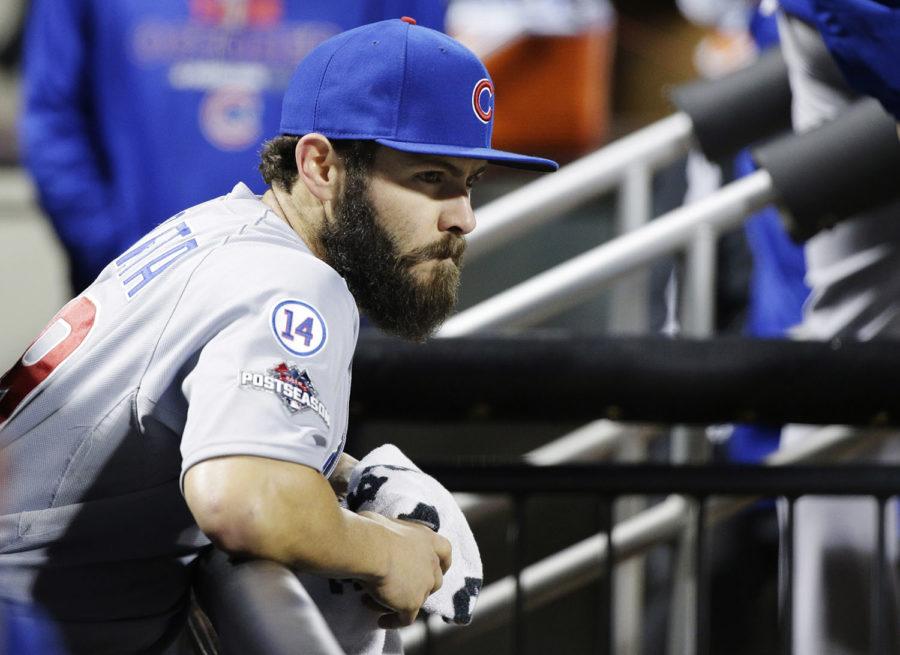 Chicago Cubs pitcher Jake Arrieta watches from the dugout during the sixth inning of Game 2 of the National League baseball championship series against the New York Mets Sunday, Oct. 18, 2015, in New York. (AP Photo/Julie Jacobson)