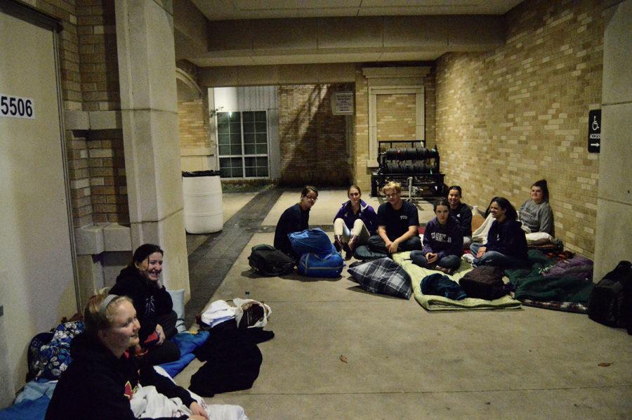 Students seek refuge from the harsh winds during their campout in the Commons Monday night, Nov. 16. 