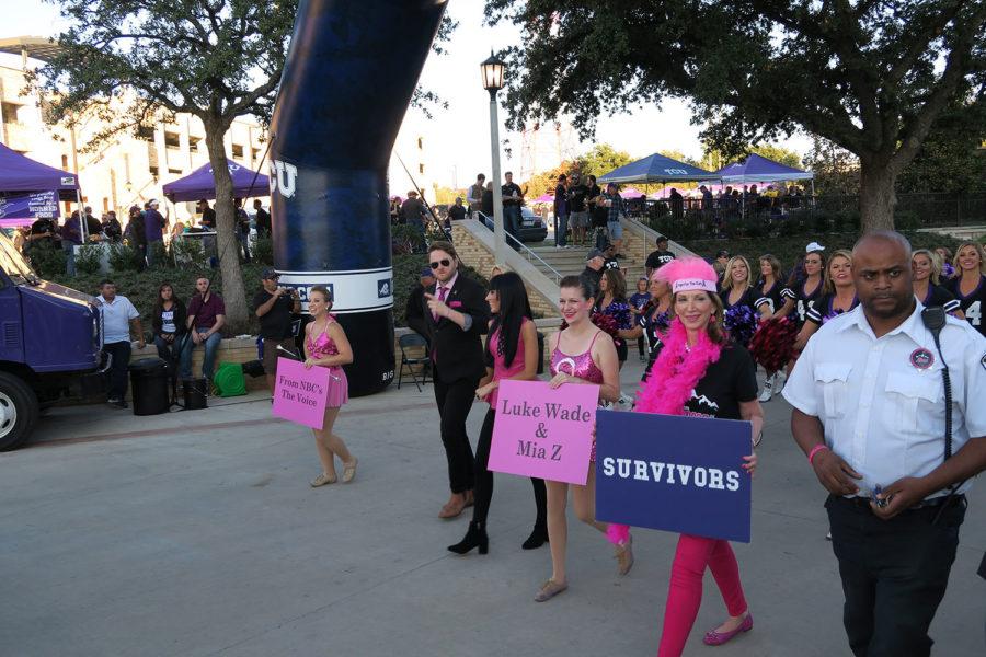 Luke Wade, Mia Z are two featured artists for 2015 Frogs for the Cure music video and Ann Louden, chair of TCU Frogs for the Cure joined the marching band to march through Frog Alley. 