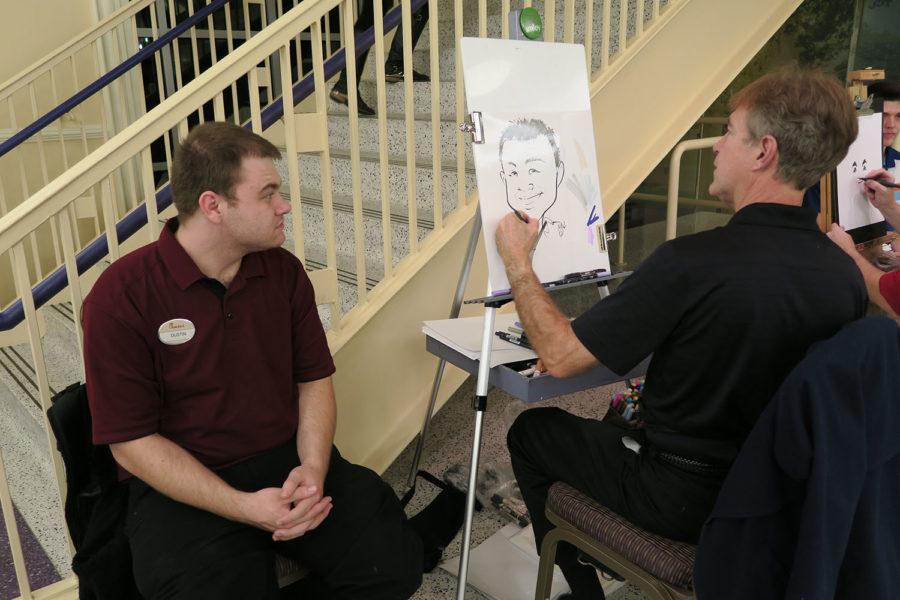 After getting off work, a Chick-fil-A staff Dustin participated in the event and got his sketch done by caricature artist Neal Asher. 