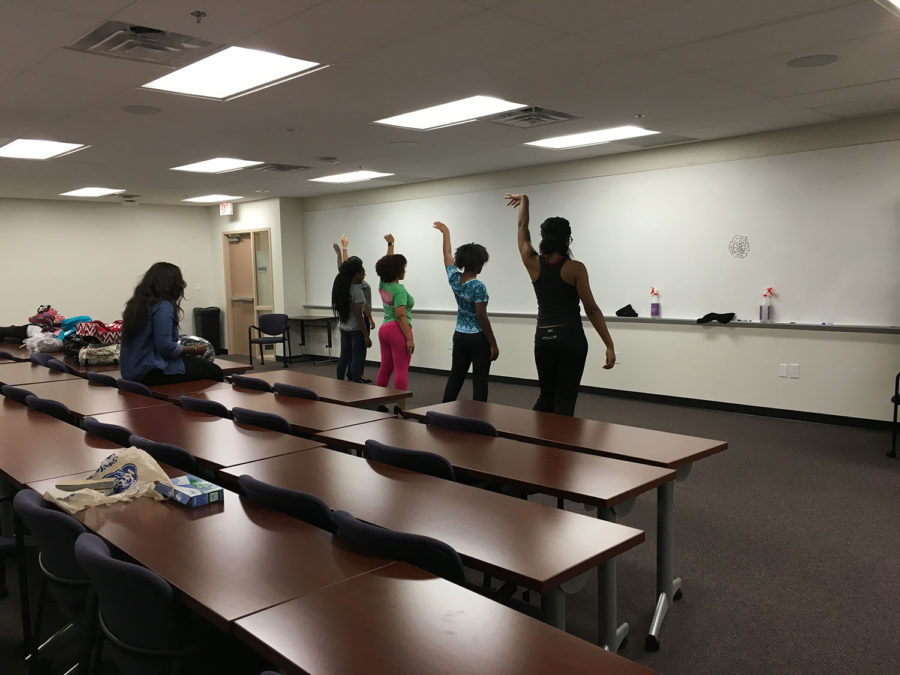 Five of the six Miss Black and Gold contestants practice for the upcoming pageant.