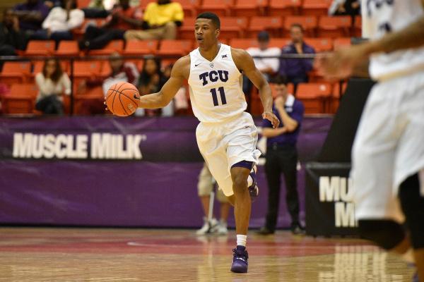 TCU guard Brandon Parrish takes the ball up the court.