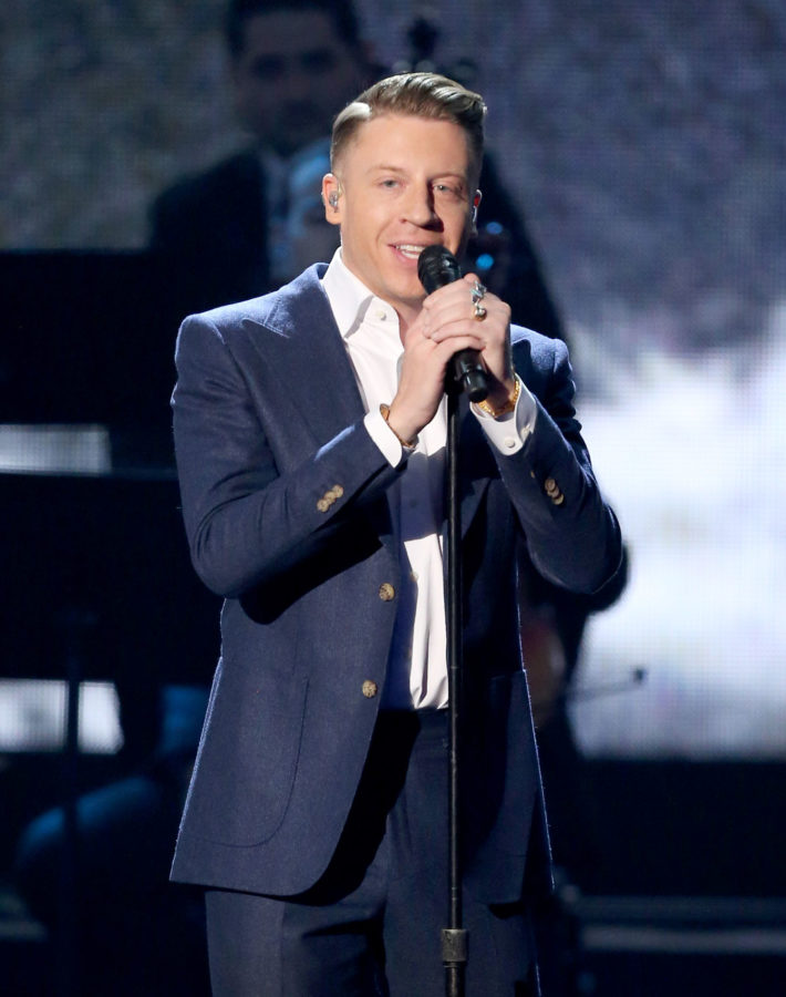 Macklemore performs at the American Music Awards at the Microsoft Theater on Sunday, Nov. 22, 2015, in Los Angeles. (Photo by Matt Sayles/Invision/AP)