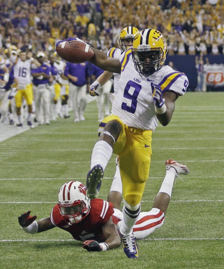 LSUs John Diarse gets past Wisconsin cornerback Darius Hillary for a 35-yard touchdown reception during the second half of an NCAA college football game Saturday, Aug. 30, 2014, in Houston. (AP Photo/David J. Phillip)
