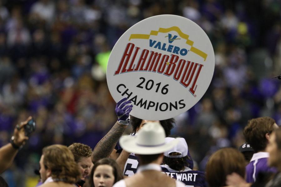 Players and fans celebrate on the field after TCU overcame a 31 point deficit to clench the title of Alamo Bowl Champions. 