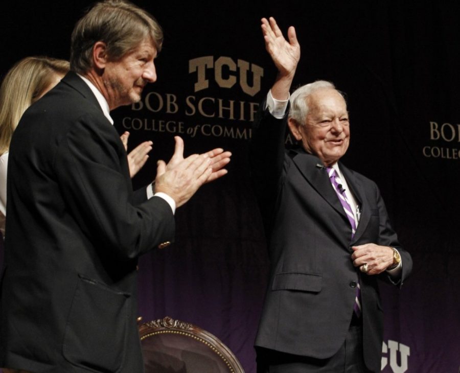 Bob Schieffer waves to audience members at the final Schieffer Symposium at TCU on April 8, 2015. Panelist P. J. ORourke is at left, in front of CBS reporter Holly Williams. 