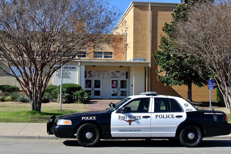 A Fort Worth police car sits in front of McLean Middle School after a reported stabbing. The student later recanted his story, saying he was playing before class and tore his shirt. The student made up the incident so that he would not get into trouble. 