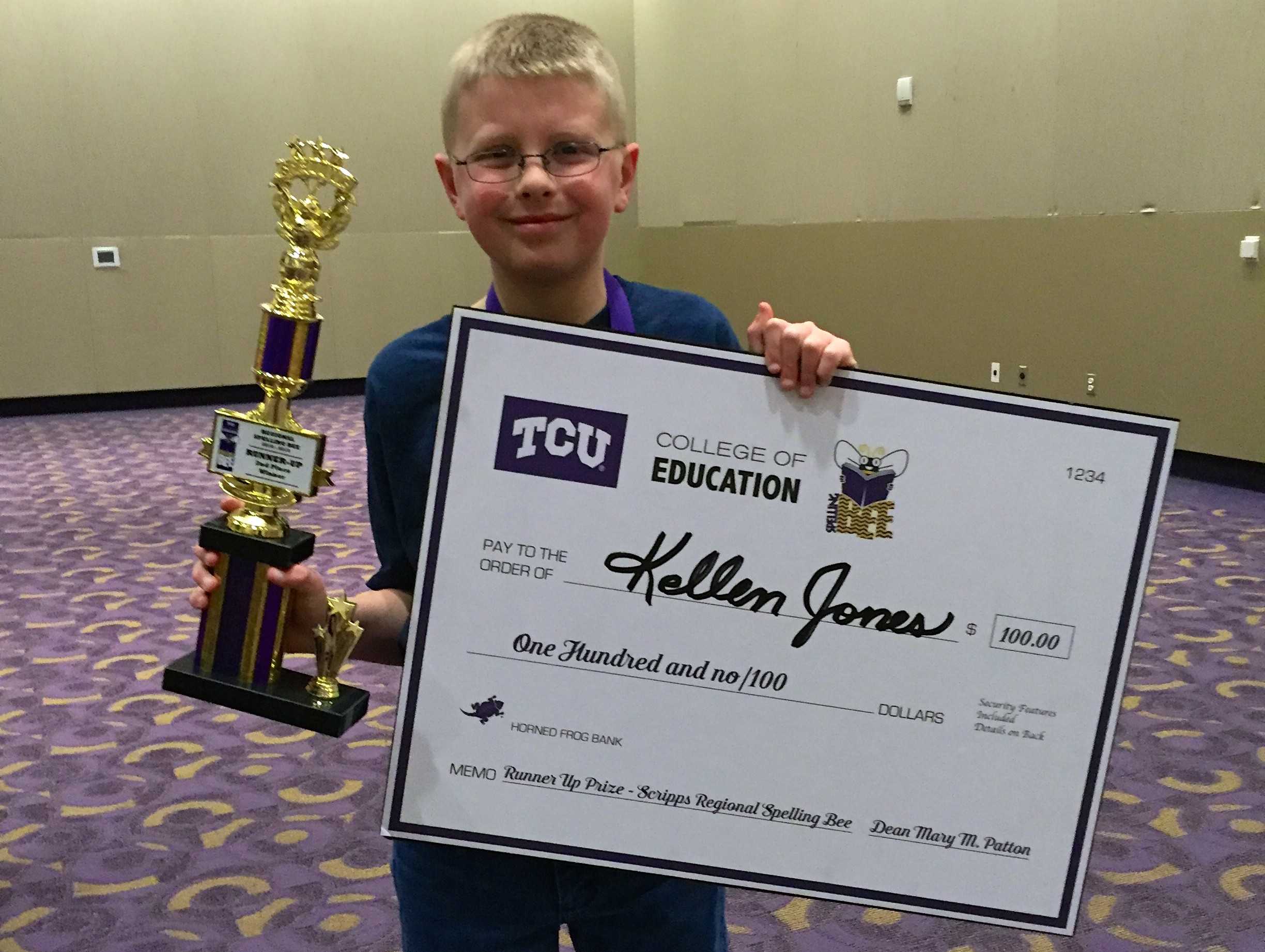 Runner-up, Kellen Jones, stands proudly with his prizes. 