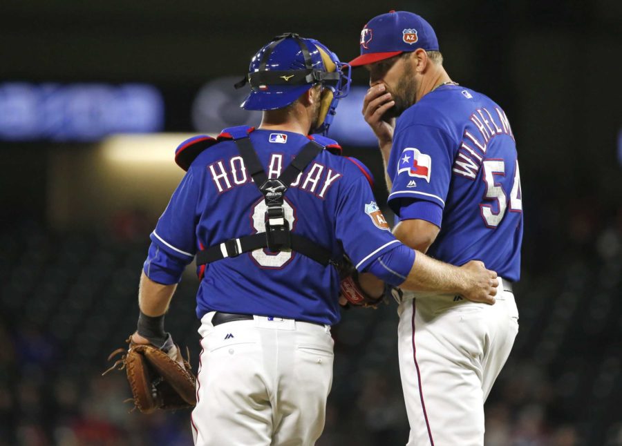 Texas+Rangers+catcher+Bryan+Holaday+%288%29+and+relief+pitcher+Tom+Wilhelmsen+%2854%29+talk+during+the+teams+exhibition+baseball+game+against+the+Cleveland+Indians+on+April+1%2C+2016.+Holaday+graduated+from+TCU+in+2010.