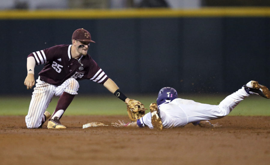 Ryan Merrill is caught stealing in an all-around tough night for the Frogs.  (AP Photo/Sam Craft)