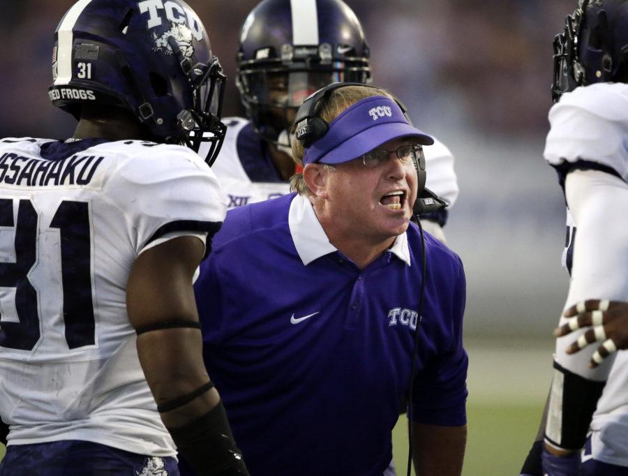 TCU head coach Gary Patterson talks with players during the first half of an NCAA college football game against Kansas State in Manhattan, Kan., Saturday, Oct. 10, 2015. (AP Photo/Orlin Wagner)
