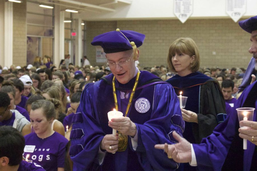 Chancellor Victor Boschini lights a candle in preparation of welcoming the Class of 2020. (Sam Bruton/Staff Photographer)