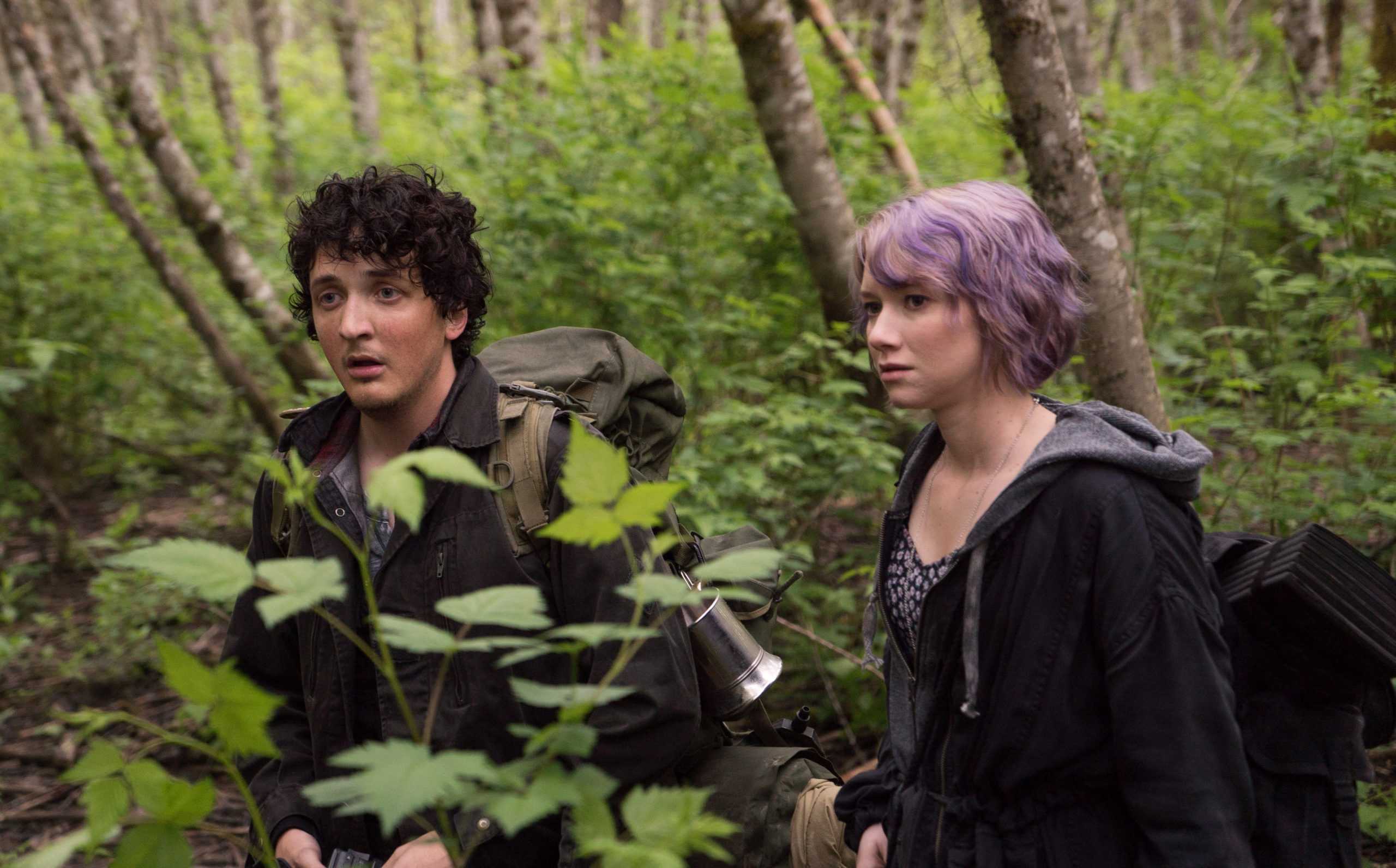 This image released by Lionsgate shows Wes Robinson, left, and Valorie Curry in a scene from "Blair Witch." (Chris Helcermanas-Benge/Lionsgate via AP)