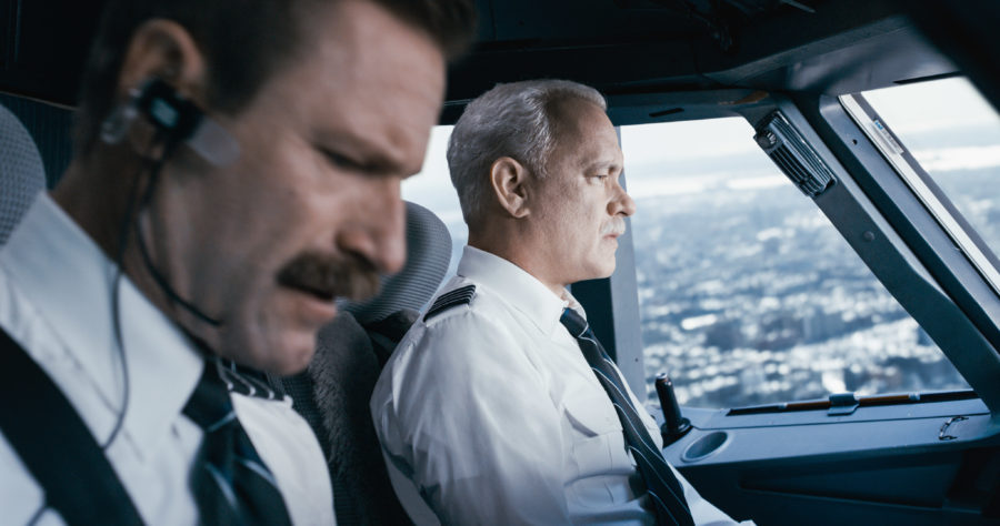 This image released by Warner Bros. Pictures shows Tom Hanks, right, and Aaron Eckhart in a scene from Sully. (Warner Bros. Pictures via AP)