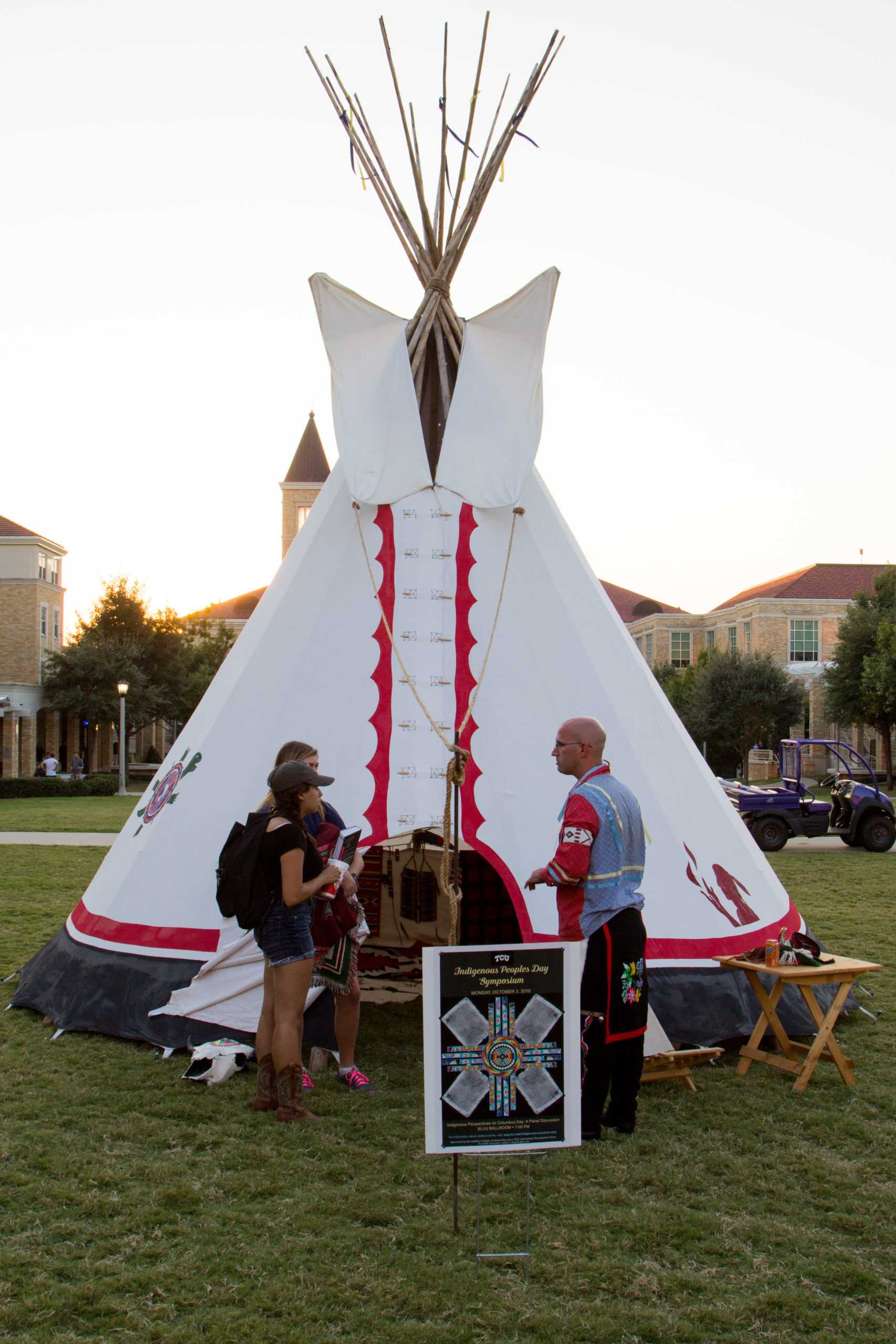 Carl Kurtz tells students about his tipi that he set up in the Commons for the Indigenous People's Day Symposium. (Sam Bruton/TCU Staff Photographer)