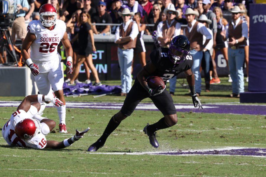 TCU+wide+receiver+Taj+Williams+looks+for+an+opening+to+run+down+field+against+Oklahoma.+%28Photo+By+Sam+Bruton%2FTCU+photographer%29.