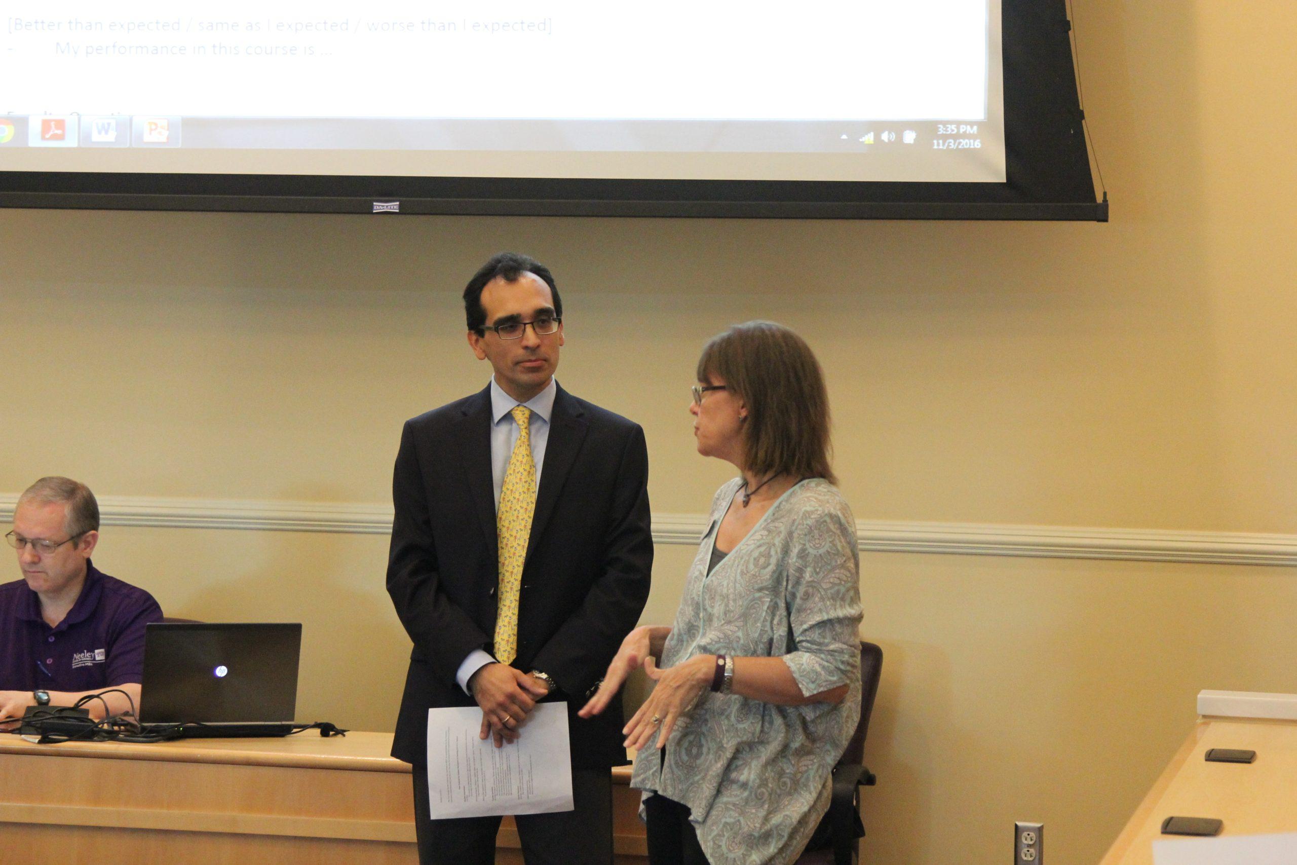 Jane Fry speaking with Chair Jesus Castro-Balbi at the Senate meeting Thursday. 