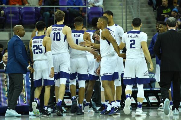 TCU basketball shares some high fives during a timeout. (Photo Courtesy of GoFrogs.com)