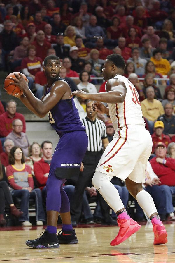 TCU+Horned+Frogs+forward+Chris+Washburn+%2833%29+looks+for+an+open+pass+while+being+guarded+by+Iowa+State+Cyclones+guard+Deonte+Burton+%2830%29+during+the+first+half+at+James+H.+Hilton+Coliseum.+%28Photo+Courtesy+of+GoFrogs.com%29
