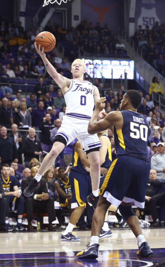 Jaylen Fisher lays up a finger-roll at the rim against West Virginia. (Photo Courtesy of GoFrogs.com)