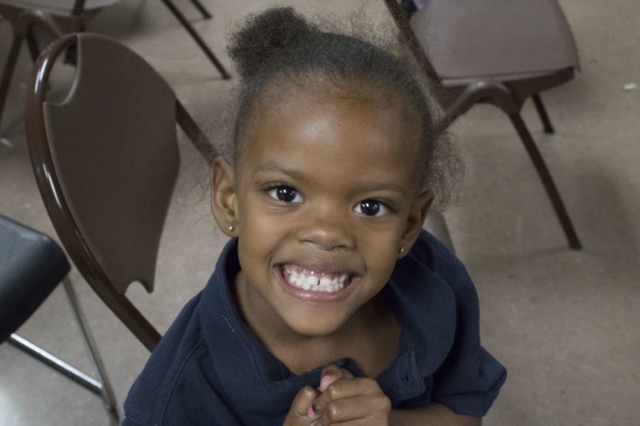 A child poses for a photo during the program. 