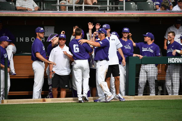 Teammate congratulate Nolan Brown, who had a career high four RBIs on Saturday (Photo by Michael Clements)