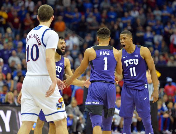 Desmond Bane (1) receives praise from teammate Brandon Parrish (11)  after hitting his free throws with 2.5 seconds left in the in an upset of No. 1 Kansas. Photo Courtesy of GoFrogs.com.