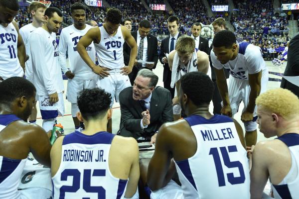 TCU head coach Jamie Dixon talks strategy with his team during a 66-59 NIT Round 1 victory over Fresno State. (Photo Courtesy of GoFrogs.com)
