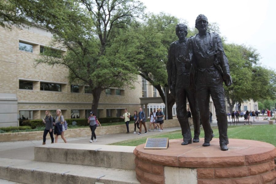 Students walk past the founders statue on their way to class March 30, 2017. 