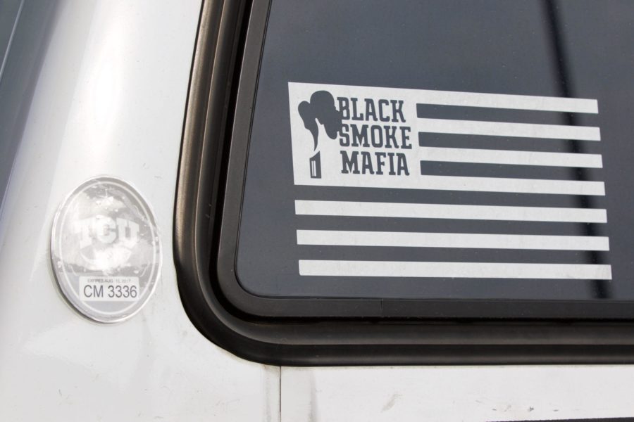 One of Black Smoke Mafia’s logos. Cooper said stickers are one of their most popular items that people ask for. (Brandon Kitchin/TCU360)
